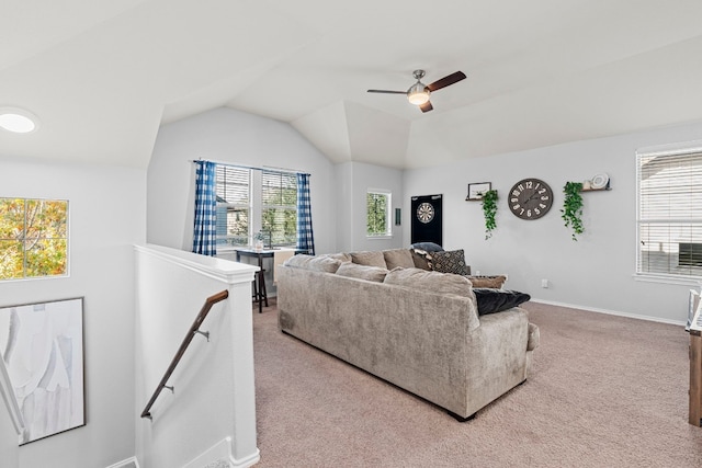 carpeted living room featuring ceiling fan and lofted ceiling