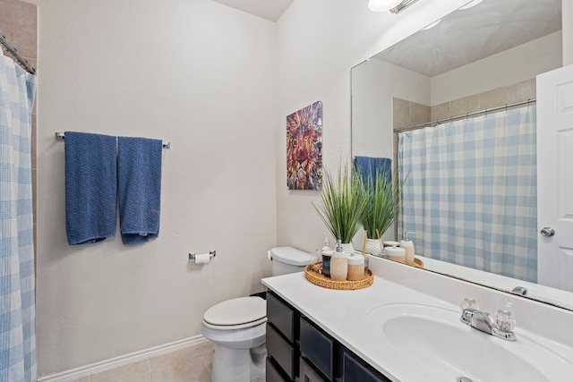 bathroom with tile patterned floors, vanity, and toilet