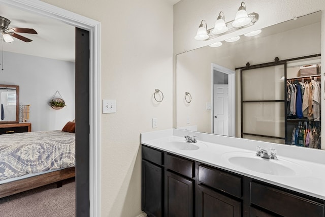 bathroom featuring ceiling fan and vanity