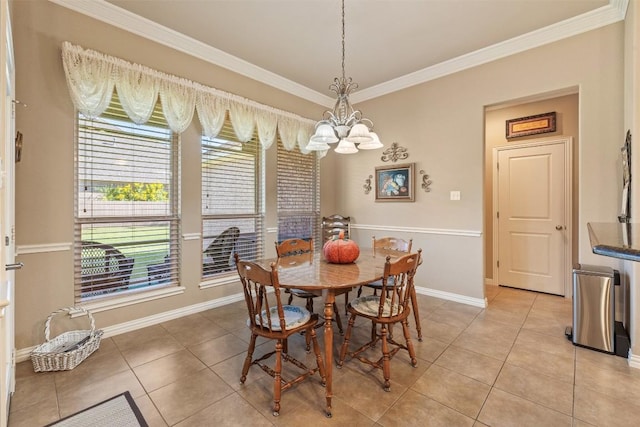 tiled dining room featuring a chandelier and crown molding