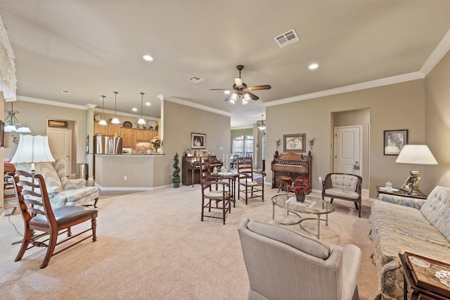 carpeted living room with ceiling fan and crown molding