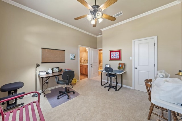 office space featuring light colored carpet, ceiling fan, and ornamental molding