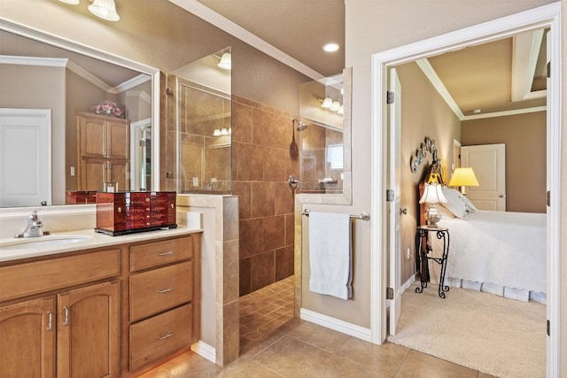 bathroom with tiled shower, vanity, tile patterned floors, and ornamental molding