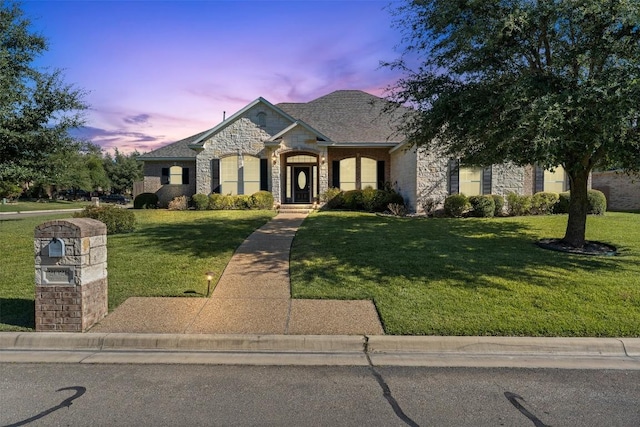 french provincial home with a yard