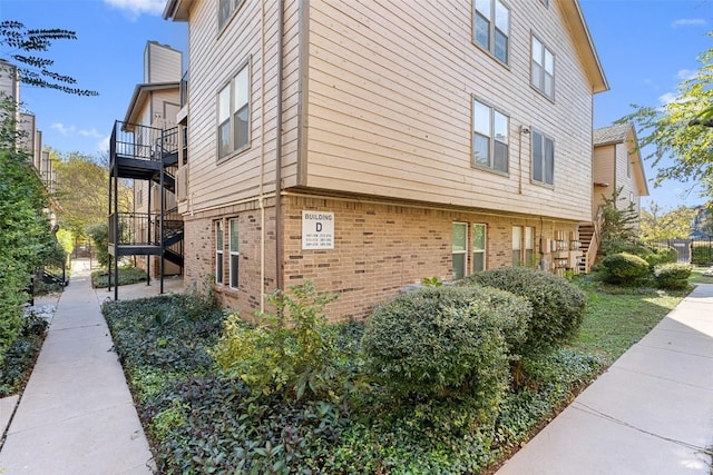 view of home's exterior with a balcony