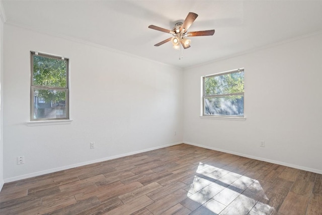 spare room with light hardwood / wood-style floors, ceiling fan, and crown molding