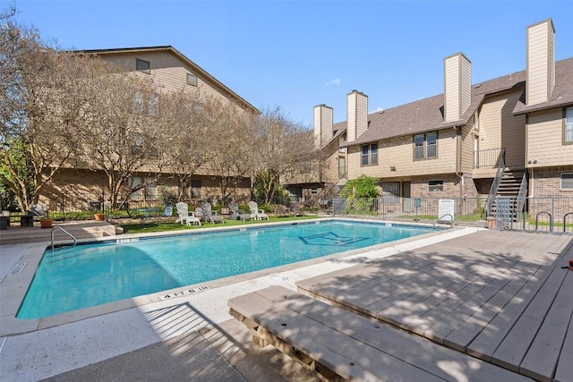 view of swimming pool featuring a deck