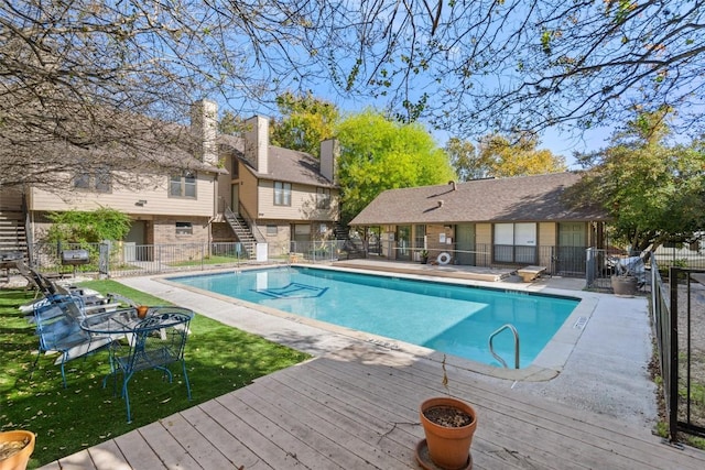 view of swimming pool with a patio area