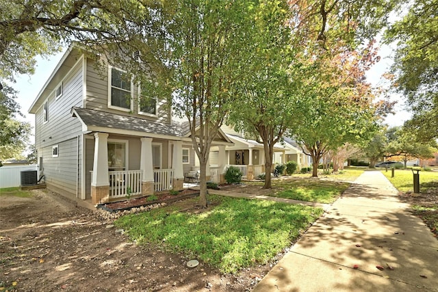 view of front of property featuring a porch and cooling unit