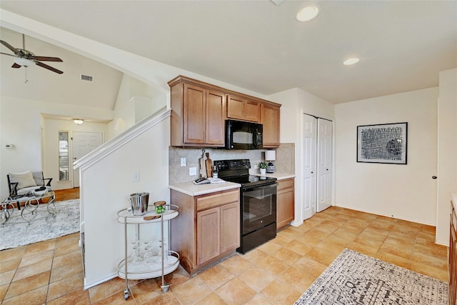 kitchen featuring decorative backsplash, vaulted ceiling, ceiling fan, and black appliances