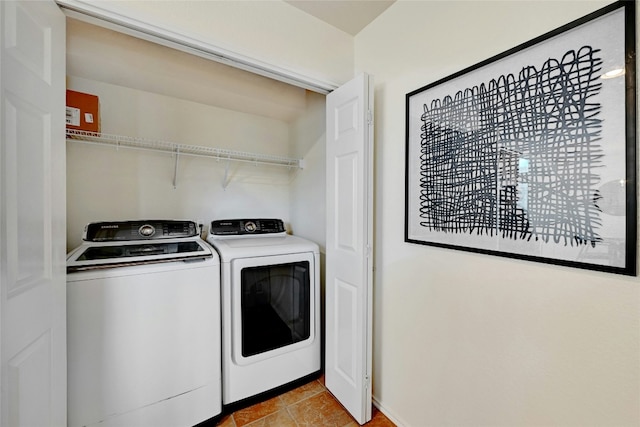 clothes washing area with washer and dryer