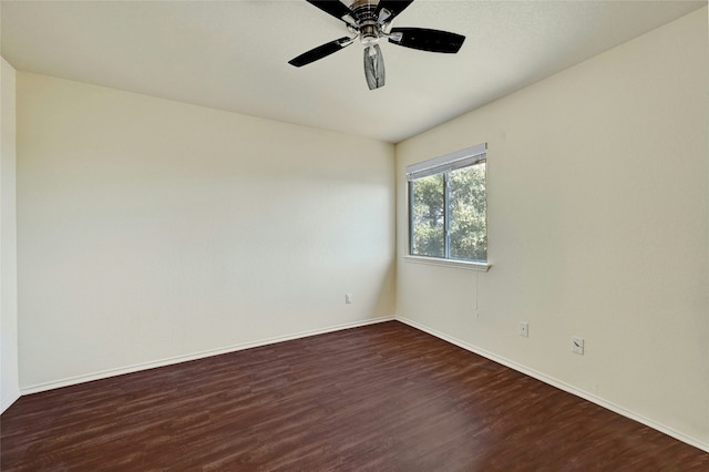 unfurnished room with ceiling fan and dark hardwood / wood-style floors