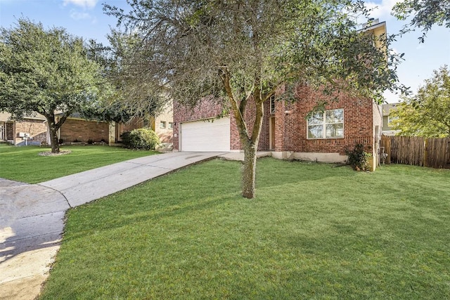 view of front of property featuring a front yard and a garage