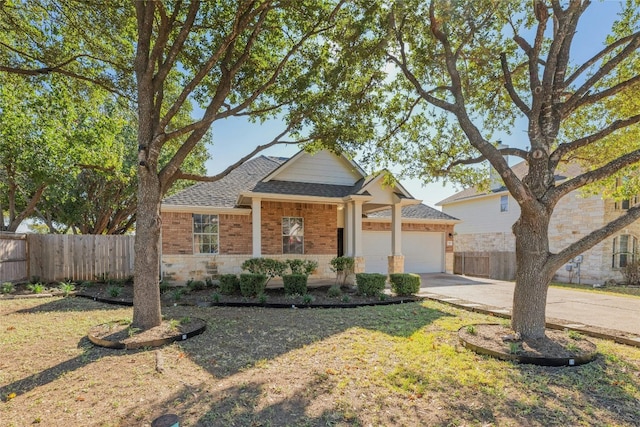 view of front of home with a garage and a front lawn