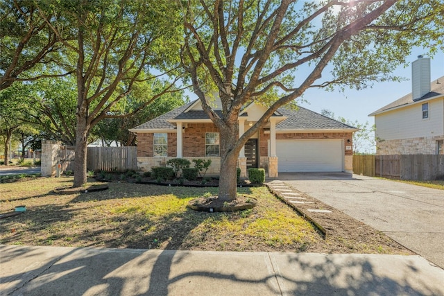 view of front of house featuring a front yard and a garage