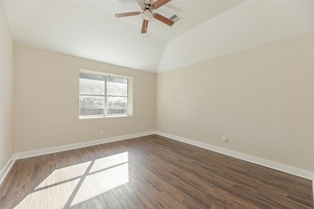 empty room featuring ceiling fan, dark hardwood / wood-style flooring, and vaulted ceiling