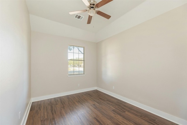 empty room featuring dark hardwood / wood-style floors and ceiling fan