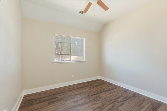 empty room with ceiling fan, dark hardwood / wood-style flooring, and lofted ceiling