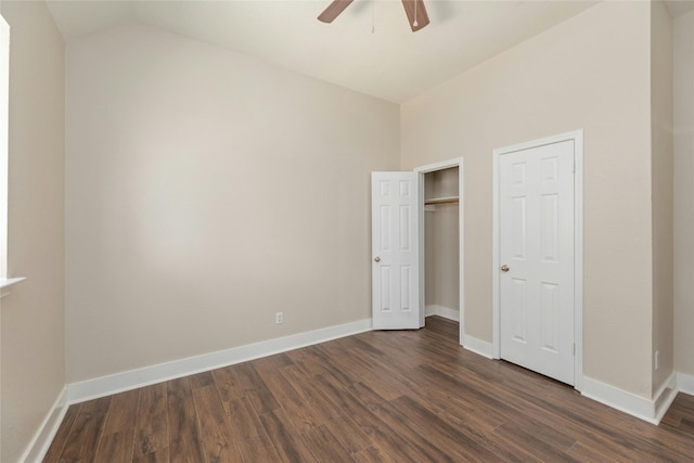 unfurnished bedroom featuring ceiling fan, dark hardwood / wood-style floors, and lofted ceiling