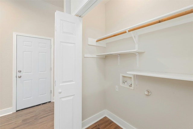 clothes washing area with hookup for a washing machine and hardwood / wood-style flooring