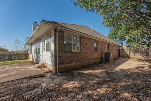 view of home's exterior with central AC unit