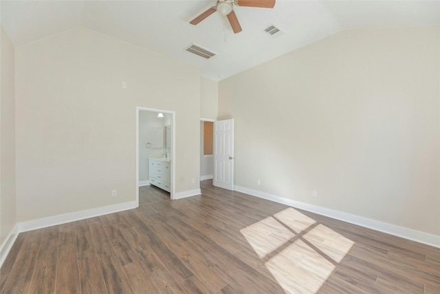 unfurnished bedroom with ceiling fan, dark hardwood / wood-style flooring, high vaulted ceiling, and ensuite bathroom