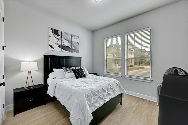 bedroom with light hardwood / wood-style flooring