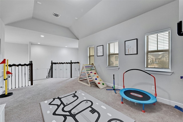 recreation room with lofted ceiling and carpet flooring