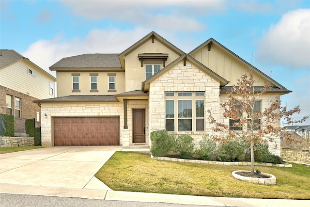 view of front of house with a front lawn and a garage