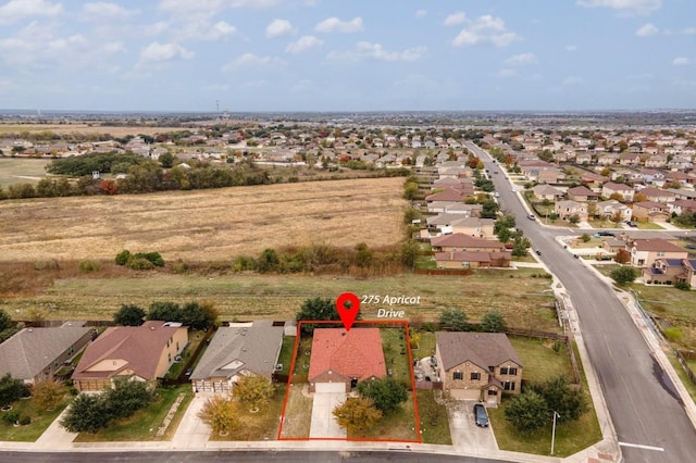 birds eye view of property with a residential view