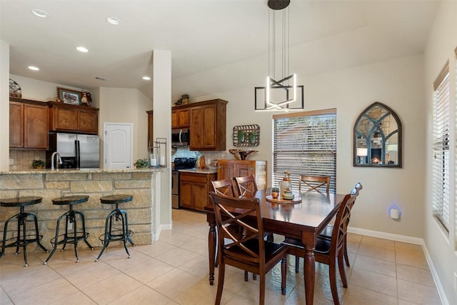 dining space with light tile patterned floors