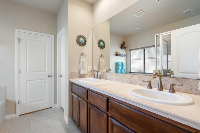 bathroom featuring tile patterned flooring and vanity