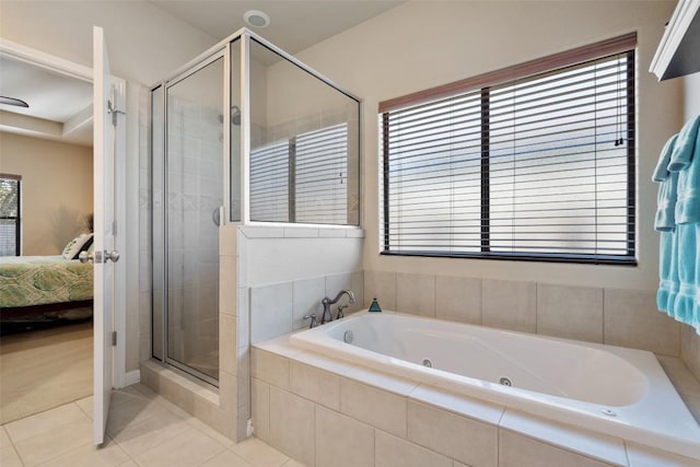 bathroom featuring a wealth of natural light, tile patterned flooring, and plus walk in shower