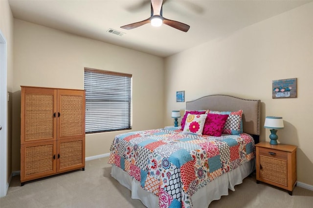 bedroom with light colored carpet and ceiling fan