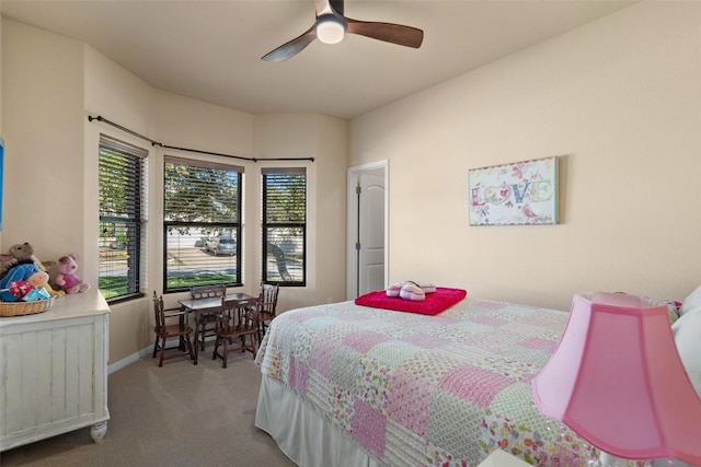 bedroom featuring ceiling fan and light carpet