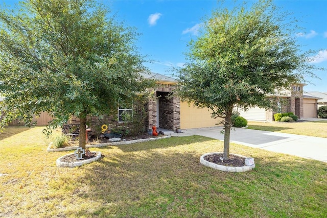 view of property hidden behind natural elements with a front lawn and a garage