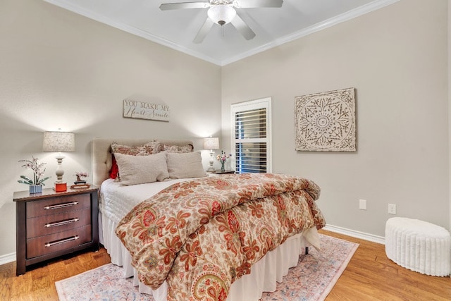 bedroom featuring light hardwood / wood-style flooring, ceiling fan, and ornamental molding