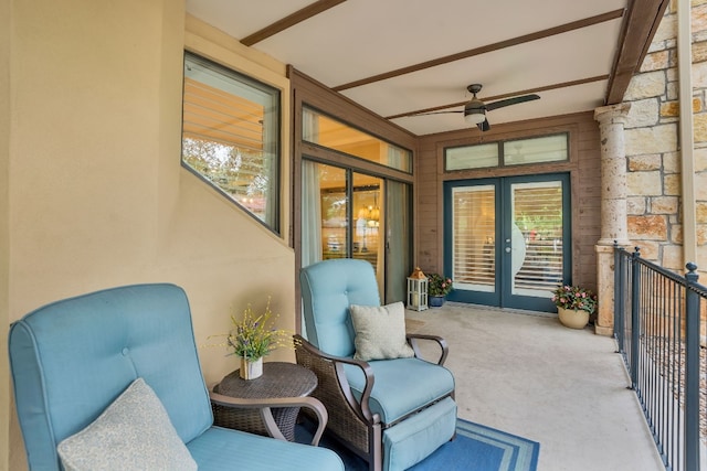 exterior space featuring beam ceiling, french doors, and ceiling fan