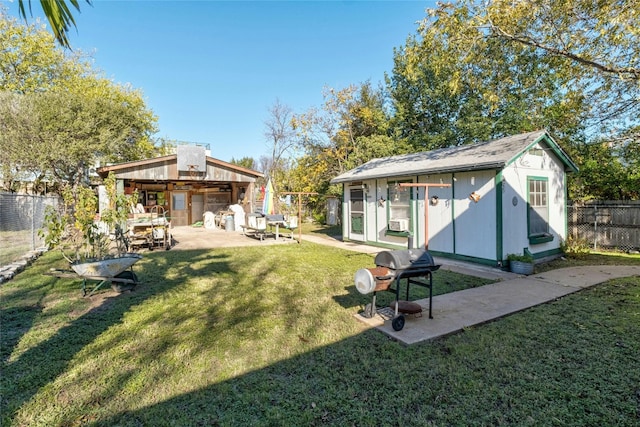 view of yard with a patio and an outdoor structure