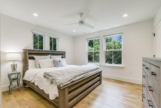 bedroom featuring light hardwood / wood-style flooring and ceiling fan