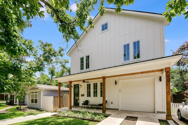 view of front of property with a porch and a garage