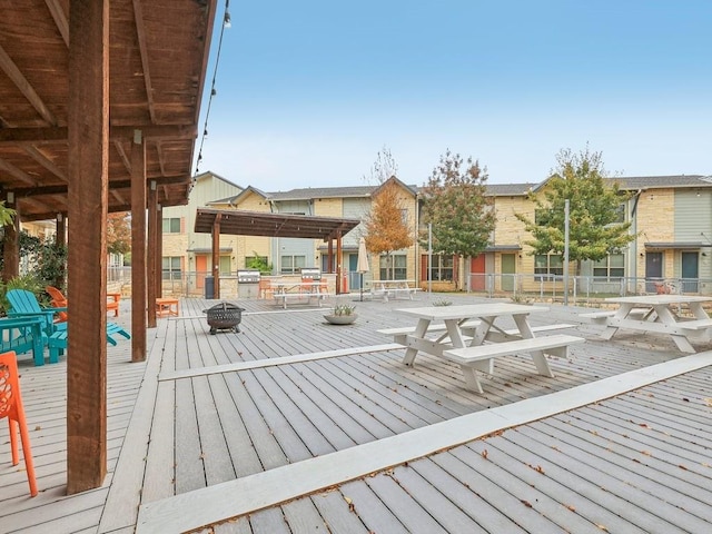 deck featuring an outdoor fire pit