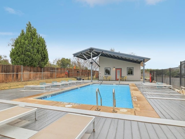 view of pool with a wooden deck