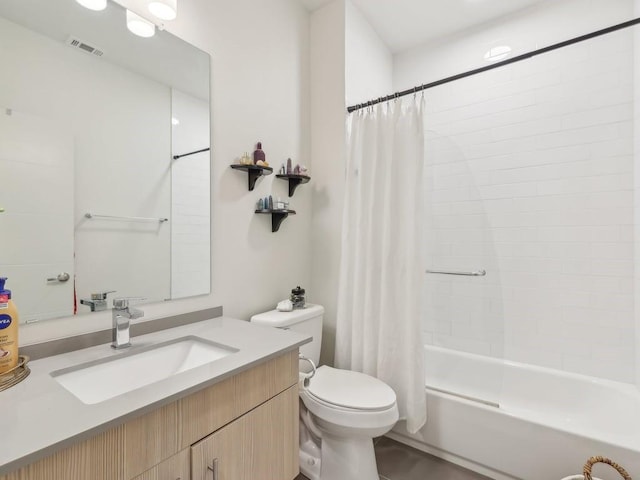 full bathroom with toilet, vanity, and shower / tub combo with curtain