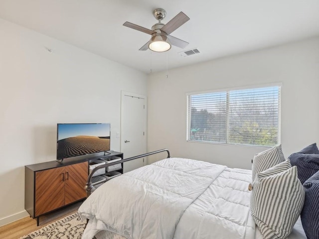 bedroom featuring ceiling fan and light hardwood / wood-style floors