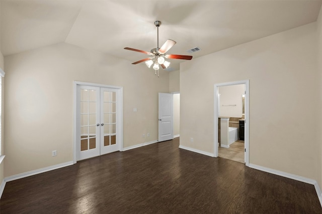 unfurnished bedroom featuring french doors, vaulted ceiling, ceiling fan, dark wood-type flooring, and connected bathroom