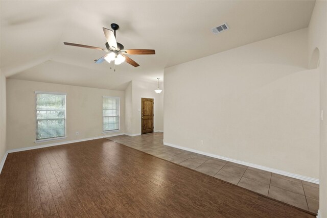 unfurnished room featuring light hardwood / wood-style flooring, ceiling fan, and lofted ceiling