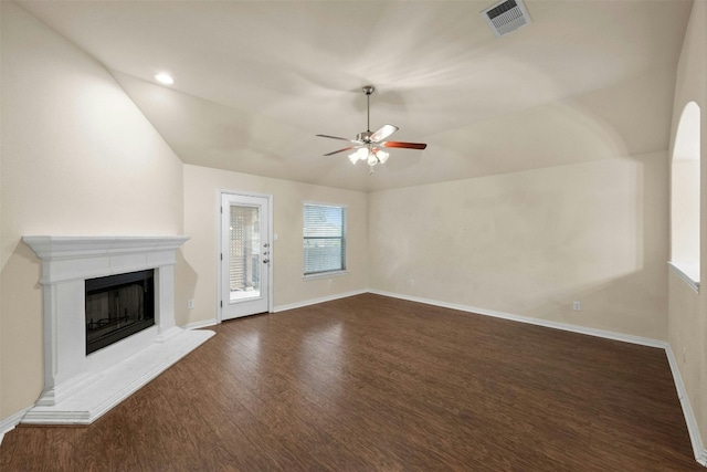 unfurnished living room featuring vaulted ceiling, dark wood-type flooring, and ceiling fan