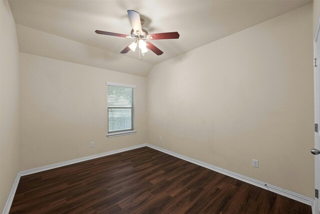 spare room featuring dark hardwood / wood-style flooring, ceiling fan, and lofted ceiling