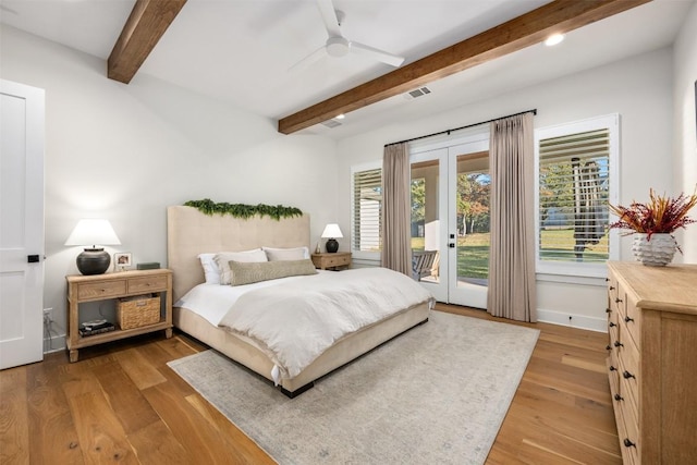 bedroom featuring french doors, access to outside, ceiling fan, beam ceiling, and hardwood / wood-style flooring